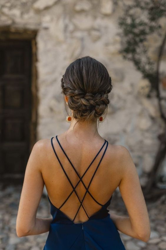 a chic and cool braided low updo with a volume on top is a cool and pretty solution for a wedding guest or bridesmaid