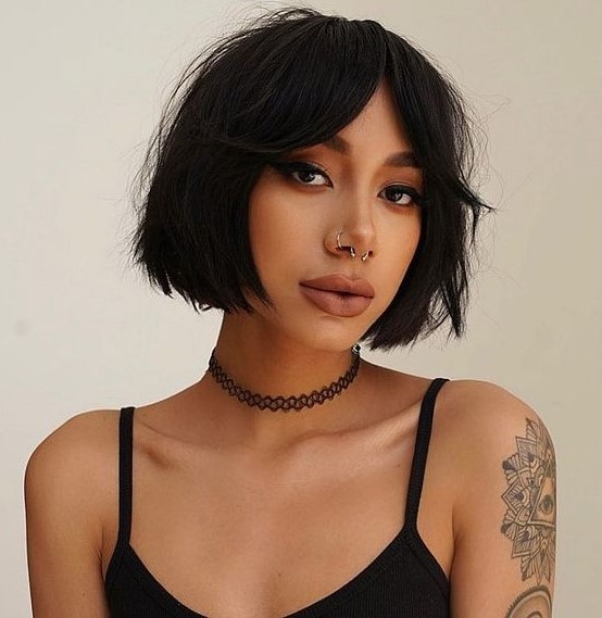 a chin-length black bob with textured hair and bottleneck bangs is a very edgy and hot idea