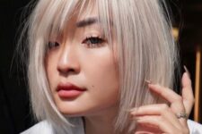 a chin-length platinum blonde bob with wispy bangs and side parting is a classyc and very airy-looking solution
