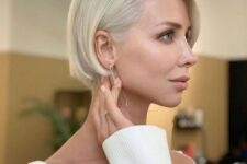a classic platinum blonde ear-length bob with side parting is a chic and refined idea that always works