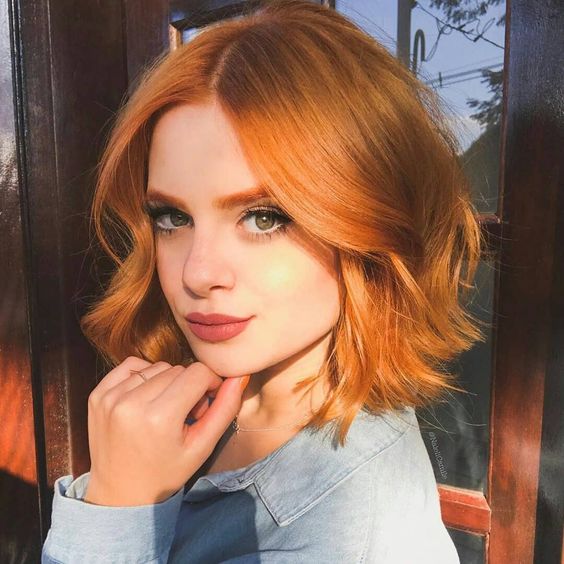 a cool copper red wavy long bob with face framing layers looks really Instagram worthy