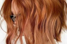 a copper red inverted long bob with a lot of dimension and waves is a lovely idea for a bold and catchy look