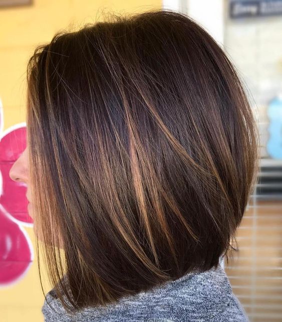 a dark brunette long bob with caramel balayage, such highlights give interest to the look