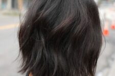 a dark brunette long bob with volume, dimension and waves is a catchy and cool idea to rock