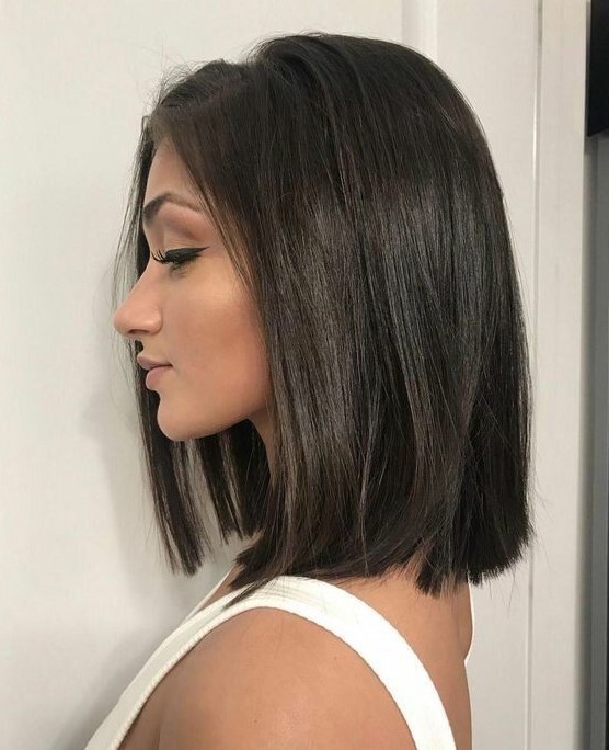 a dark brunette shoulder length blunt bob is a stylish idea to rock, and such a shiny finish is perfect