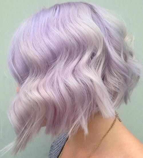 a delicate lilac wavy bob with white highlights and a lot of volume is a catchy and fresh idea