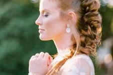 a dimensional and loose braid from top to the side with a volume on top is a lovely idea for a boho bride