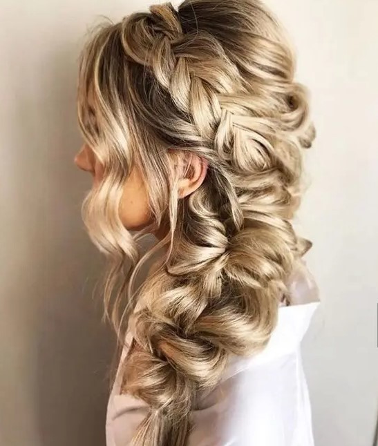 A dimensional and loose side braid with a halo and some face framing waves is a stylish and catchy idea