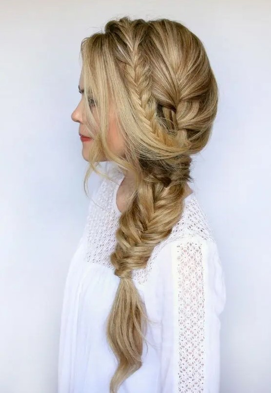 a dimensional side fishtail braid, a braided halo and some locks down is a lovely idea for a boho bride