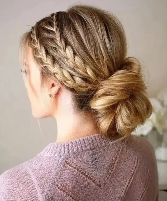 a double braided halo with a low twisted low bun guarantees a picture perfect look for the whole day