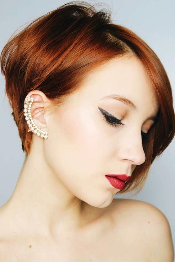 a ginger ear length bob with side parting and volume is amazing for a bold look, make a statement with color