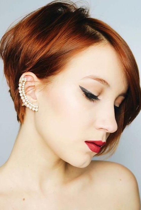 a ginger red ear length bob with side parting and volume is amazing for a bold look, make a statement with color