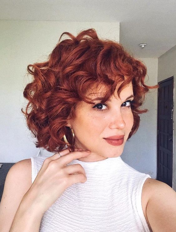 a gorgeous bold red curly bob with some bangs is a fantastic idea, these curls paired with this color look amazing