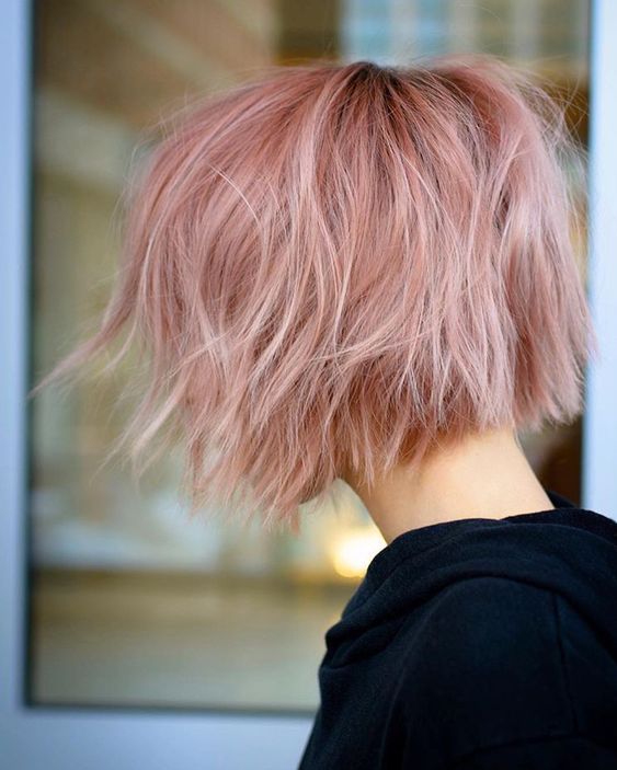A jaw line pink wavy and textured bob with a darker root is a cool and catchy idea