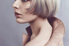 a layered ear-length bob with graphite grey and platinum blonde, with a classic fringe will catch an eye with color contrast