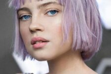 a lilac jaw-length bob with wispy bangs and a bit of texture is a relaxed hairstyle with a catchy color