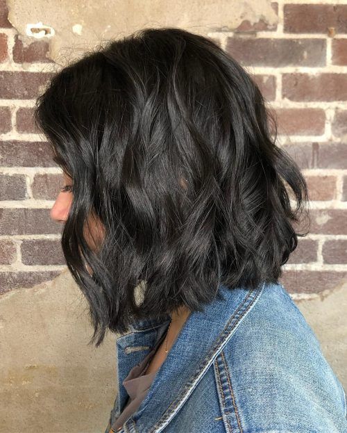 a long black bob with elegant waves and a shiny finish is a stylish and cool idea to rock