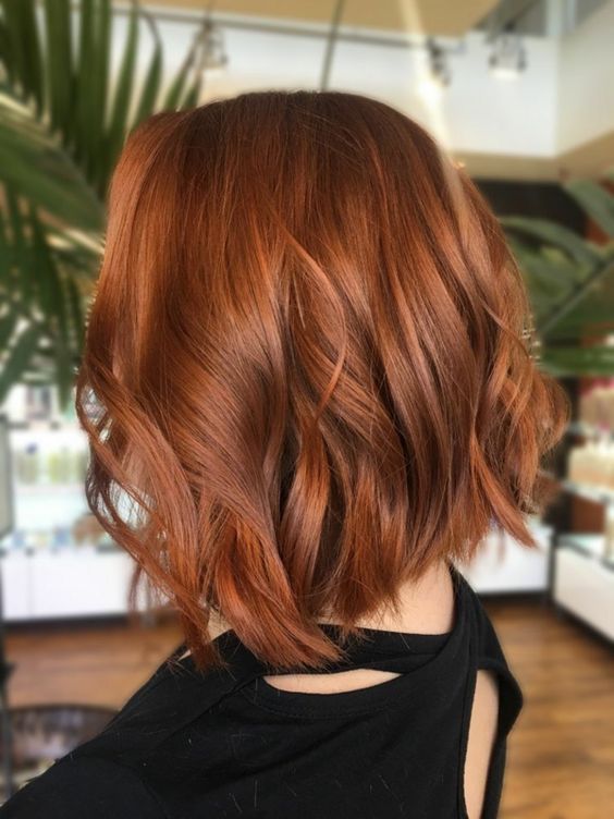 a long copper red wavy bob is an elegant and chic idea, this color isn't too bright and is great for the fall