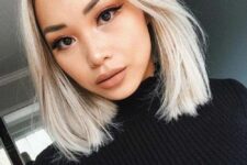 a long icy blonde bob with middle part and a bit of texture is a cool and bright solution