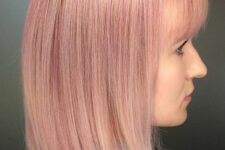 a long straight pastel pink bob with a classic fringe charms with its soft shade