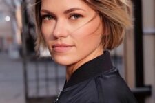 a lovely brunette ear-length bob with blonde balayage and messy volume is a stylish and cool idea to rock