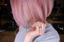 a lovely pink midi bob with straight hair and a lot of volume is a hot and chic idea