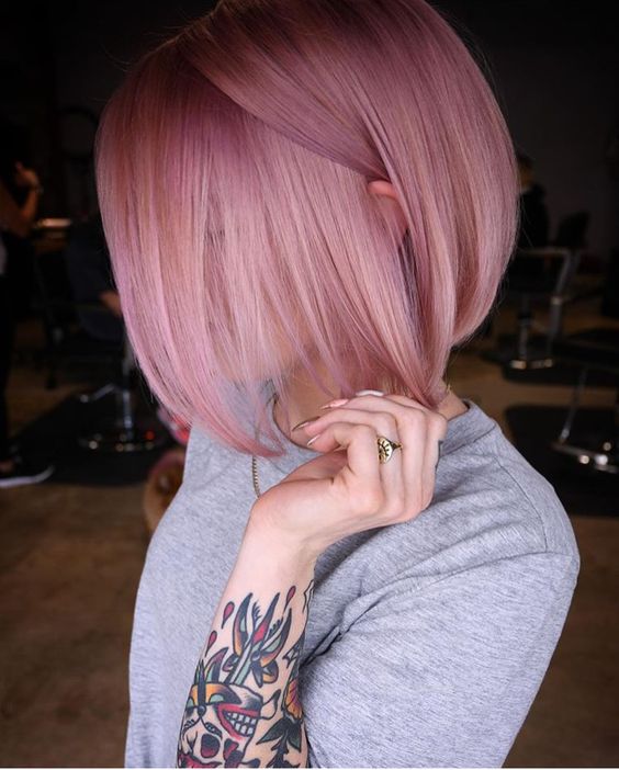a lovely pink midi bob with straight hair and a lot of volume is a hot and chic idea