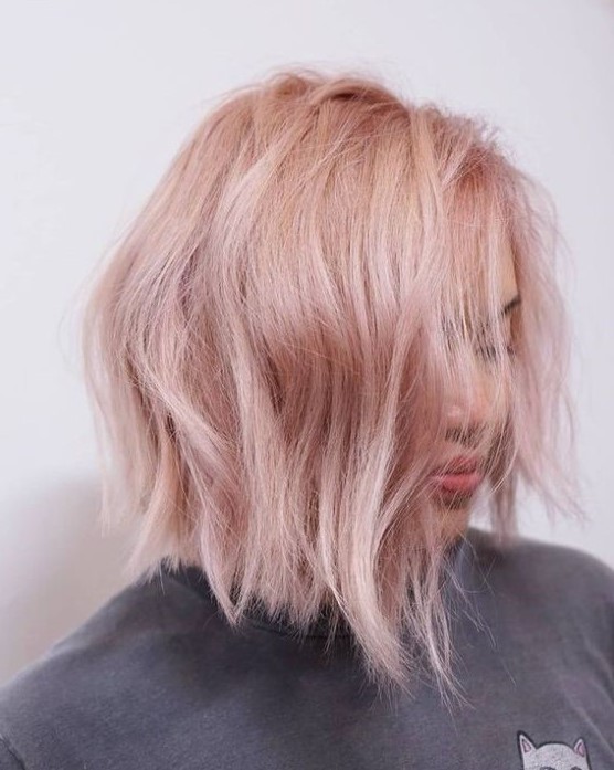 a lovely textural blush pink wavy bob with side parting is a cool and fresh idea to rock right now