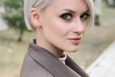 a minimalist platinum blonde ear-length bob with side part and a sleek top is a classic idea that is always a perfect solution
