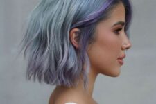 a pale blue choppy long bob with lilac locks and waves plus side part is a chic and bold idea