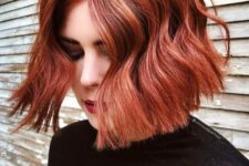 a red chin-length wavy bob with a lot of volume is a gorgeous idea for a bold and catchy fall look