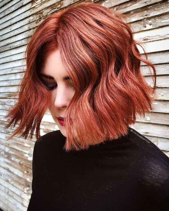 a red chin length wavy bob with a lot of volume is a gorgeous idea for a bold and catchy fall look