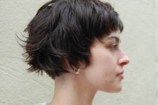 a shaggy ear-length brunette bob with messy bangs is a catchy solution, and waves make it more effortless