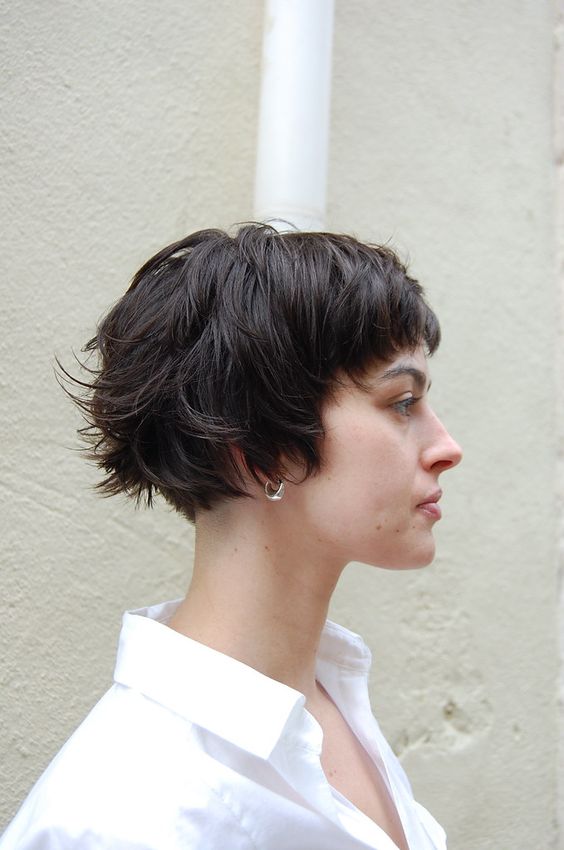 a shaggy ear length brunette bob with messy bangs is a catchy solution, and waves make it more effortless