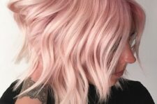a soft pink long bob with waves and a slight ombre effect is a catchy and chic idea to rock