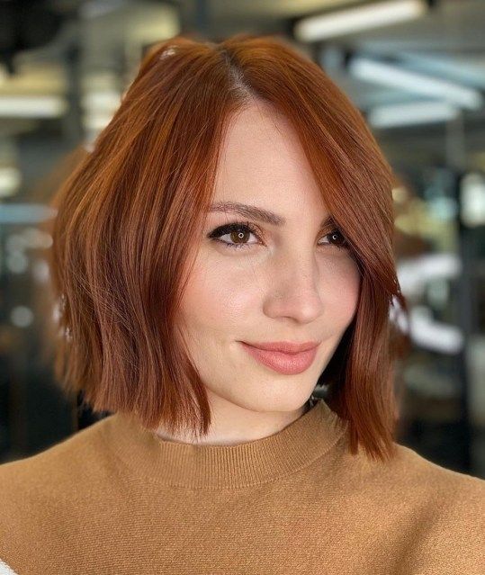 a stylish copper red midi bob with a bit of waves is an elegant and stylish solution, the color is very sophisticated