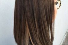 a stylish dark brunette long bob with blonde touches underneath is a cool idea, and blodne highlights will make your look stand out