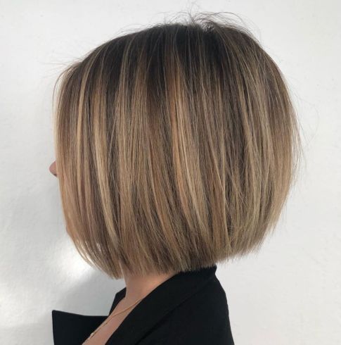 a stylish midi bronde bob with highlights and a darker root, with balayage is a chic and elegant idea for a bold look