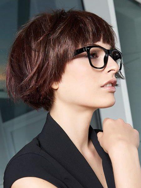 an auburn ear length bob with a classic fringe and a lot of volume is a catchy and stylish idea to rock