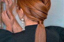 an elegant and chic low ponytail with a voluminous braided top and some waves down is perfect for a bridesmaid