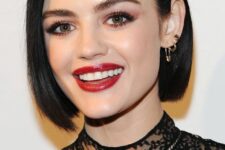 an elegant blunt black bob with side parting and a shiny finish is a chic and catchy idea for a modern look