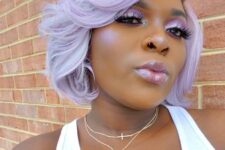 an extra bold lilac chin-length bob with waves and a lot of volume looks jaw-dropping