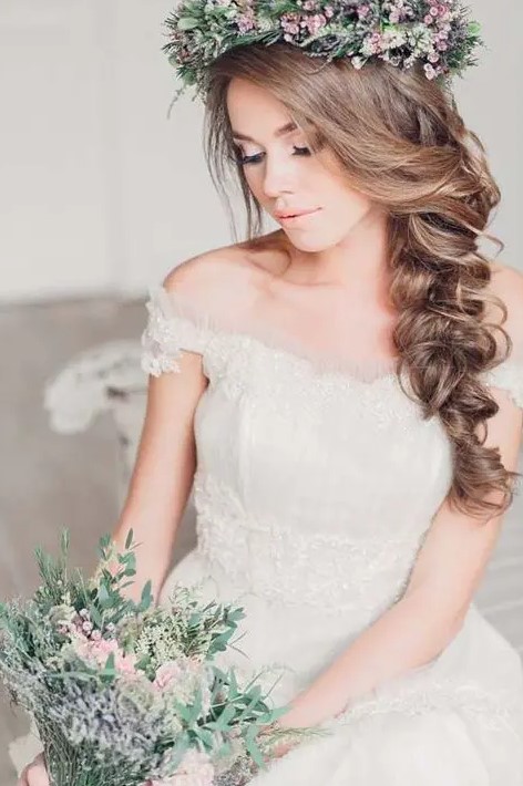 make your own messy and curly braid and crown it all with a fresh flower crown