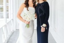 12 a gorgeous navy fitting maxi dress with embellishments, a high neckline and long sleeves is pure elegance and chic