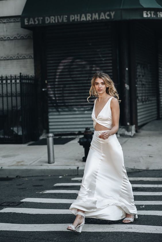 a plain maxi dress with thick straps, a cutout on the front and silver shoes will be a bold solution for any pre-wedding party