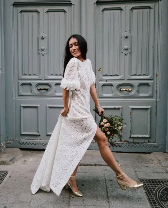 a printed maxi white dress with a high neckline, short fluffy sleeves, metallic shoes are a cool combo for a bridal shoer or a casual wedding