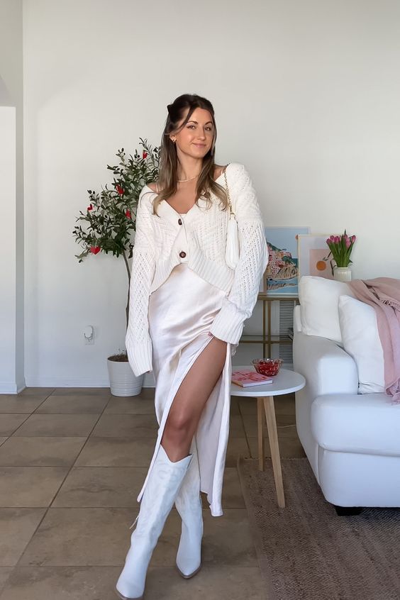 a relaxed fall bridal shower outfit with a silk slip midi dress, a cropped cardigan, cowboy boots and a small bag