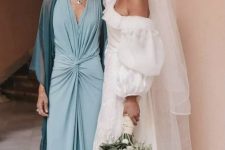 34 a blue draped maxi dress with a front slit and a teal cover up plus a necklace for a super chic mother of the bride look