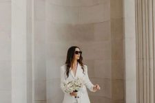38 a classy white pantsuit with flare pants and white shoes is great for any wedding-related party or a wedding