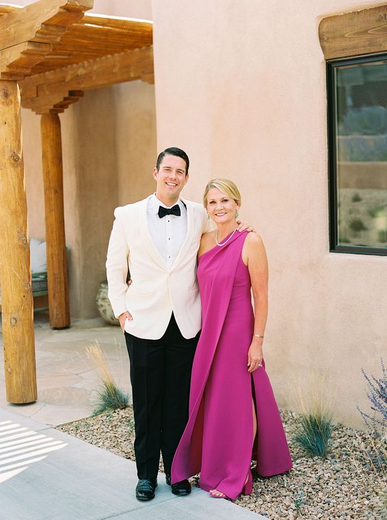 a fantastic fuchsia one shoulder maxi dress with a draped detail, a side slit and matching fuchsia shoes for the mother of the groom
